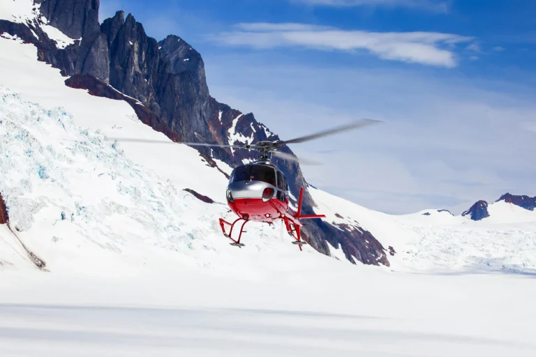 rescue helicopter landing on a glacier scaled
