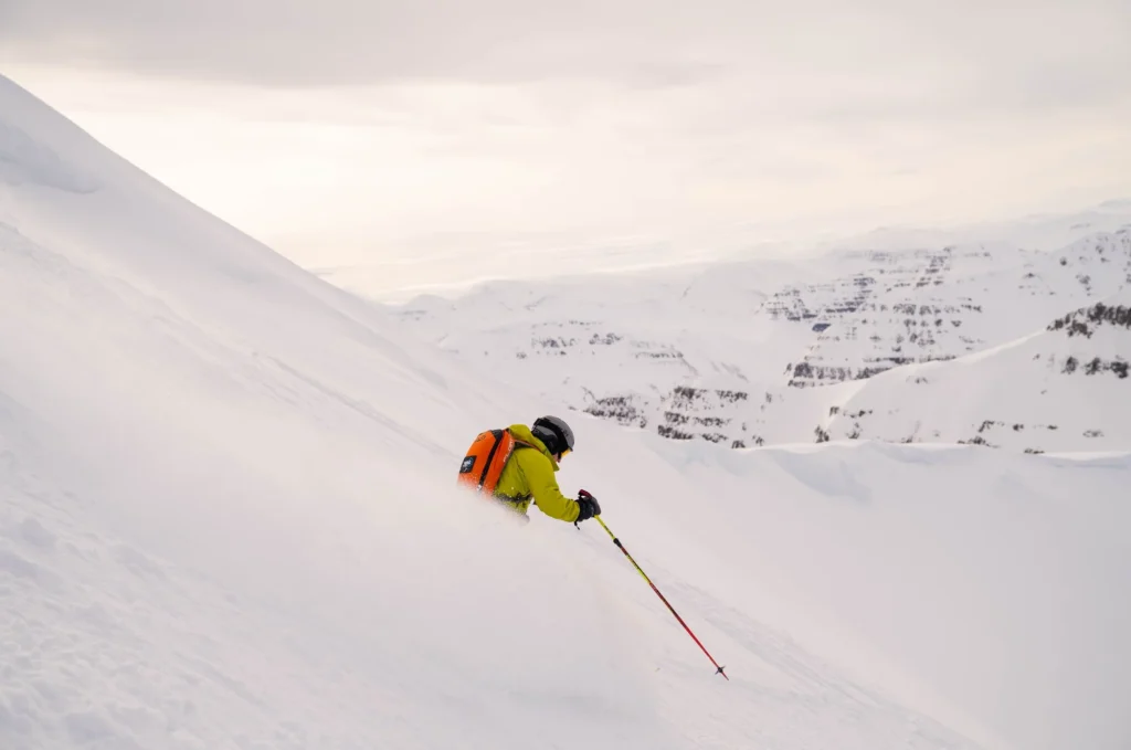 skier carving snowy mountain slope scaled
