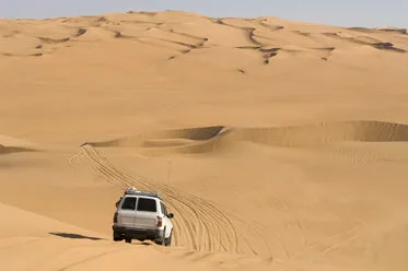suv on sand dunes erg awbari sahara desert fezzan libya ISF