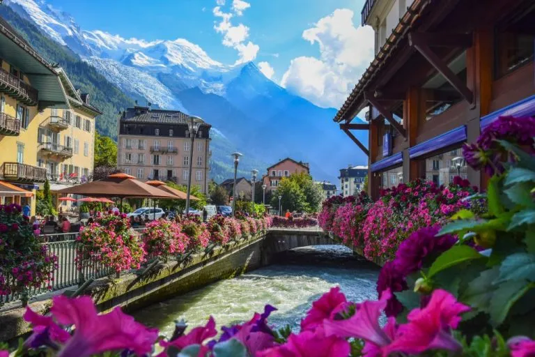 View of the Arve river and Mont Blanc massif from the centre of Chamonix x